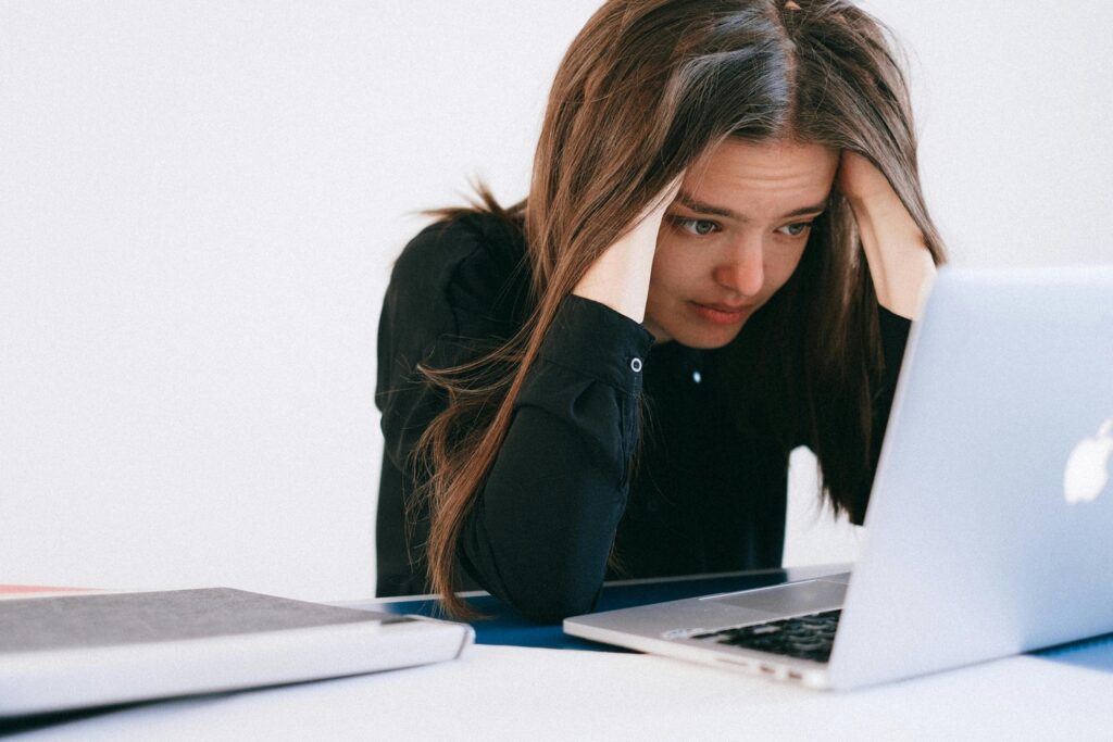 Overwhelmed woman showing anxiety as a signal from the nervous system